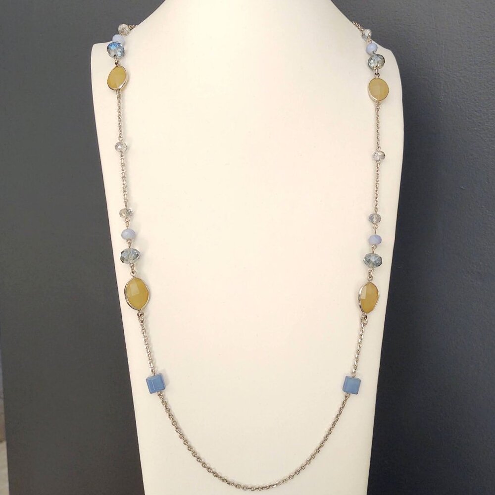 Long silver necklace with blue and yellow glass beads